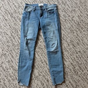 Frame Denim Light-Mid Blue Skinny Jeans with Raw Hem